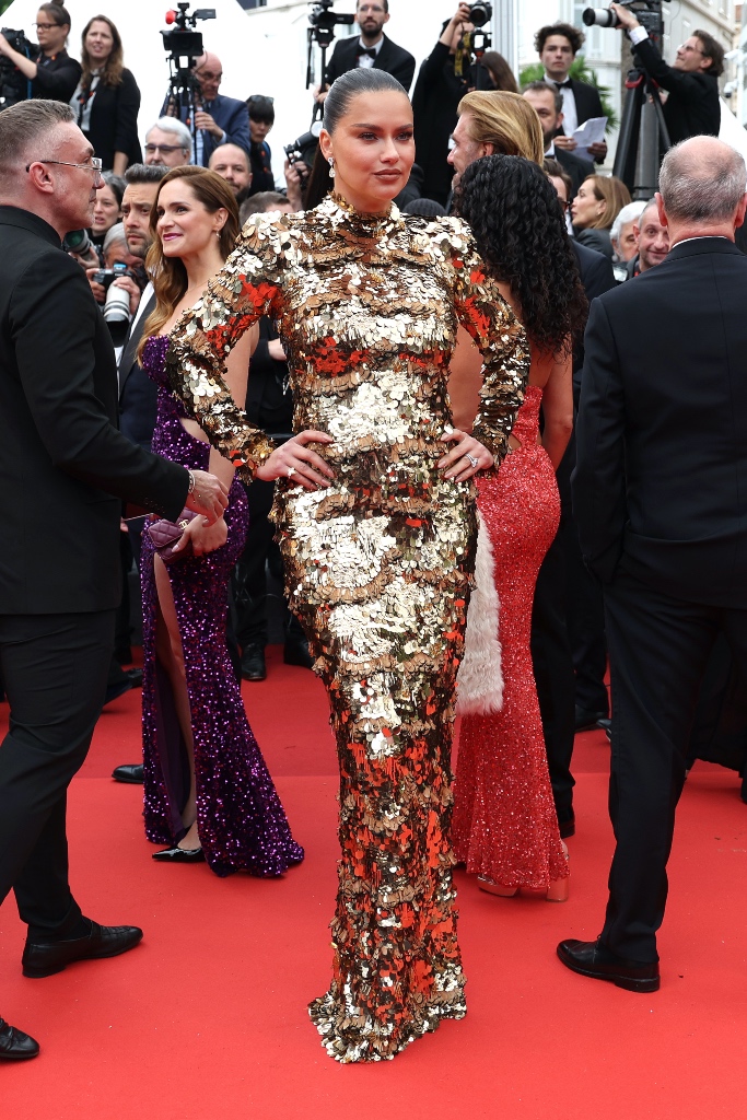 Adriana Lima, Cannes, Cannes Film Festival 2023, Naeem Khan, dress, gown, gold gown, sequin dress, feather dress, gold dress, slit dress, Jimmy Choo, sandals, heels, high heels, heeled sandals, stilettos, stiletto sandals, stiletto heels, gold heels, gold sandals, metallic sandals, patent sandals, mirrored sandals, mirrored heels, red carpet, celebrity red carpet, Patrick Ta, makeup, Danielle Priano, hair, Maeve Reilly, celebrity styling, celebrity style